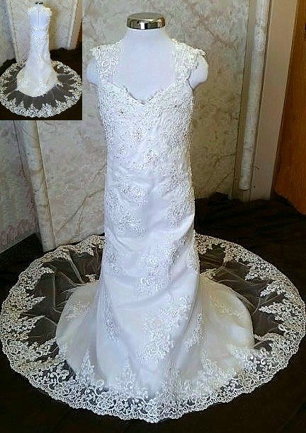 dress with cut out back and lace edged train